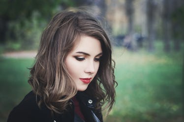 Lovely Girl in the Park. Pretty Woman with Long Bob Hairstyle