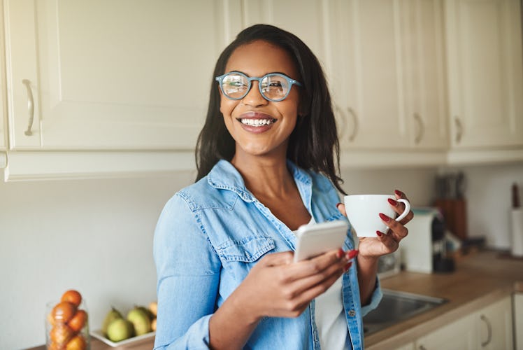 Woman laughing while texting crush "would you rather" questions