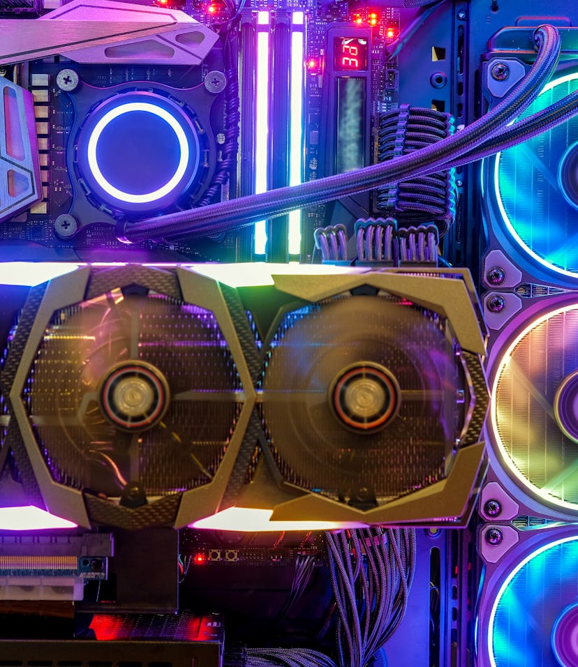 Close-up and inside Desktop PC Gaming and Cooling Fan CPU with multicolored LED RGB light show statu...