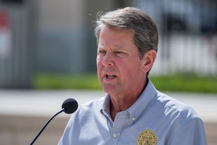 Georgia Governor Republican Brian Kemp participates in a press conference outside the state capitol ...