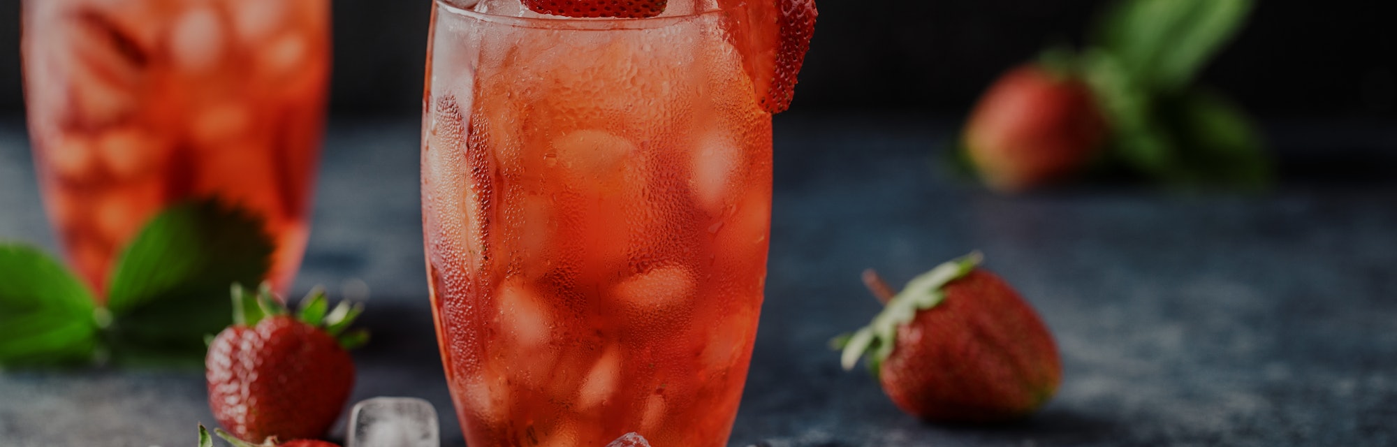 Fresh strawberry cocktail. Fresh summer cocktail with strawberry and ice cubes. Glass of strawberry ...