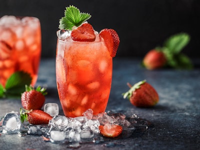 Fresh strawberry cocktail. Fresh summer cocktail with strawberry and ice cubes. Glass of strawberry ...