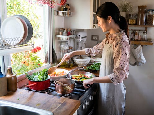 Woman cooking lunch in a kitchen