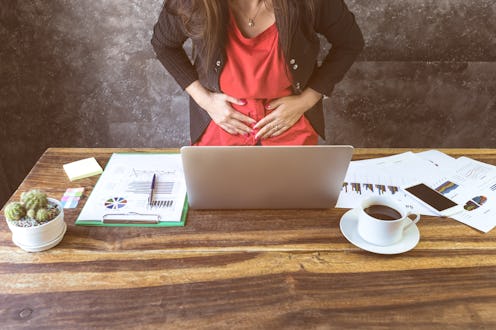 close up of young business woman having stomach ache or Chronic gastritis, ulcer,in office, Abdomen...