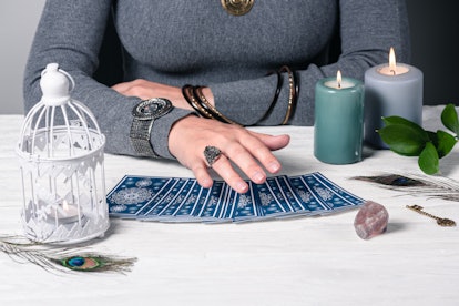 Fortune teller reading future by tarot cards concept.