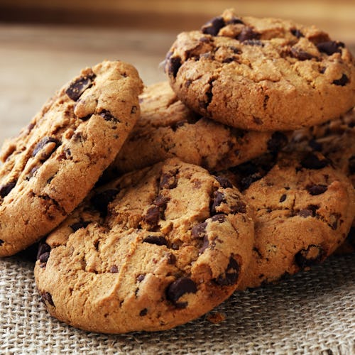 Chocolate cookies on wooden table.  