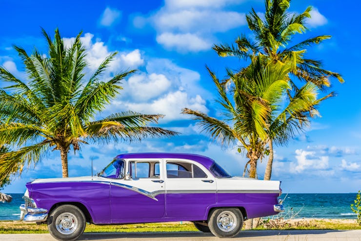 Havana, Cuba - June 30, 2017: HDR - American blue classic car parked on the Malecon near the beach i...