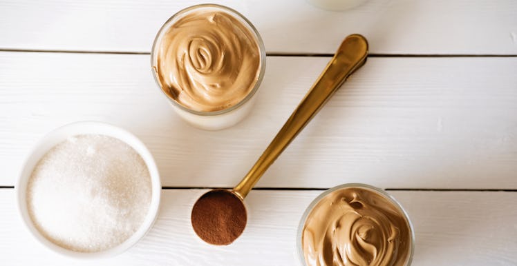 Iced frothy Dalgona Coffee, a trendy fluffy creamy whipped coffee. Korean drink latte espresso with ...