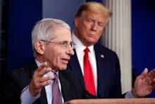 President Donald Trump watches as Dr. Anthony Fauci, director of the National Institute of Allergy a...