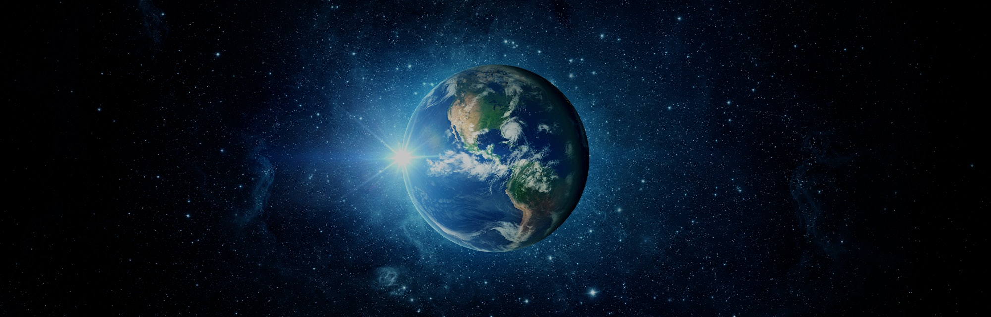 Panoramic view of the Earth, sun, star and galaxy. Sunrise over planet Earth, view from space.