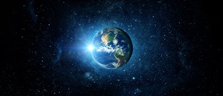 Panoramic view of the Earth, sun, star and galaxy. Sunrise over planet Earth, view from space.