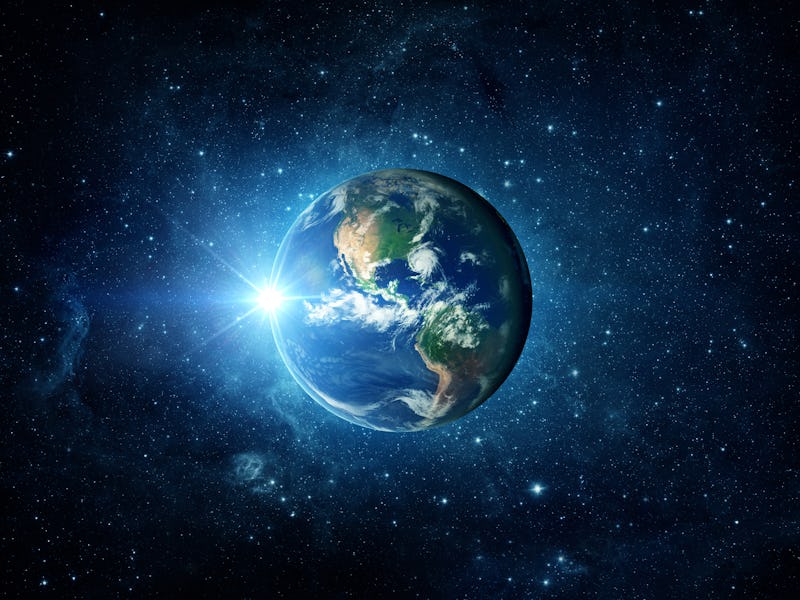 Panoramic view of the Earth, sun, star and galaxy. Sunrise over planet Earth, view from space.