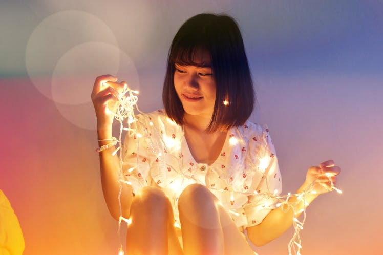 Women with LED String Light and illuminated at night