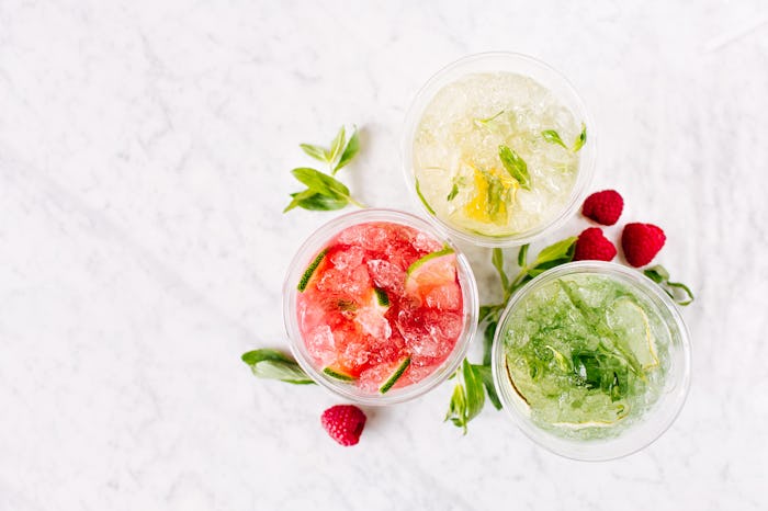Assorted cocktail drinks on a marble table