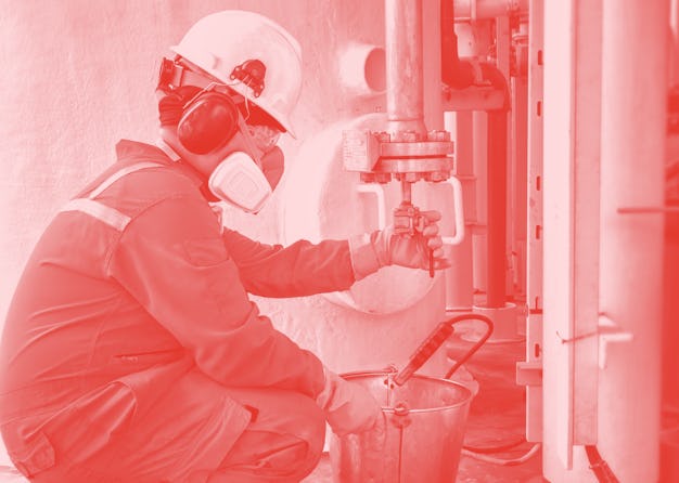 operator recording operation of oil and gas process at oil and rig plant, offshore oil and gas indus...