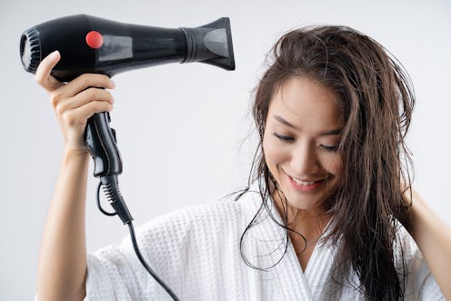 Asian woman drying your hair after showering