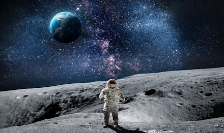 Moon surface with astronaut on it. Planet Earth on the background. Apollo space program. Elements of...