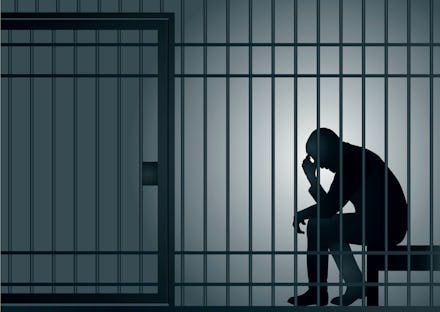 Concept of the prison with the arrest of a criminal. The prisoner is sitting in his cell and despera...