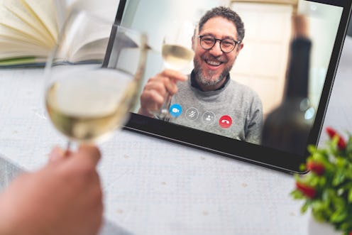 Best friends drinking and toasting online on a video call during the quarantine lockdown. Stay safe ...