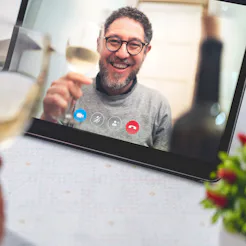 Best friends drinking and toasting online on a video call during the quarantine lockdown. Stay safe ...