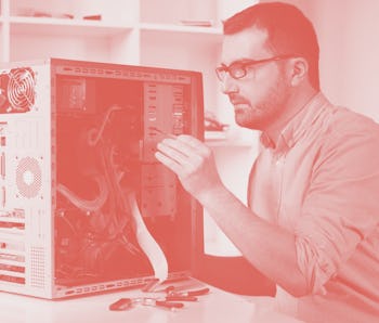 Professional man repairing and assembling a computer desktop