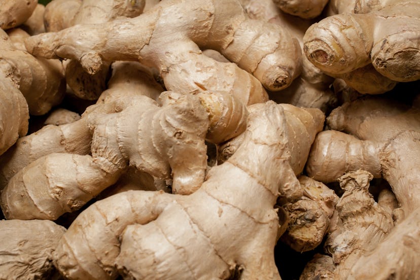 a lot of ginger. A lot of Ginger Root. ginger harvest. ginger root food background. closeup photo / ...