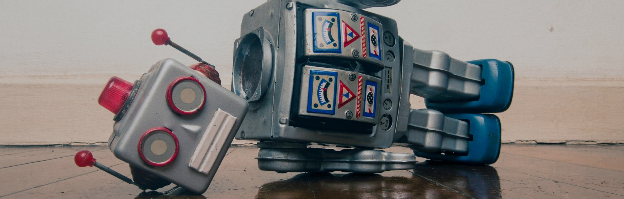 vintage bot lost his head on a old wooden floor with reflection 