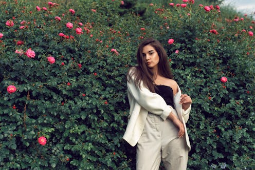 Young brunette in stylish modern clothes
