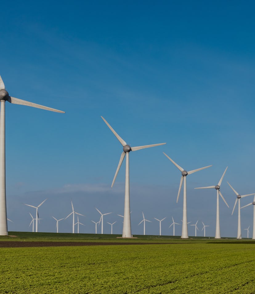 Offshore Windmill farm in the ocean Westermeerwind park , windmills isolated at sea on a beautiful ...