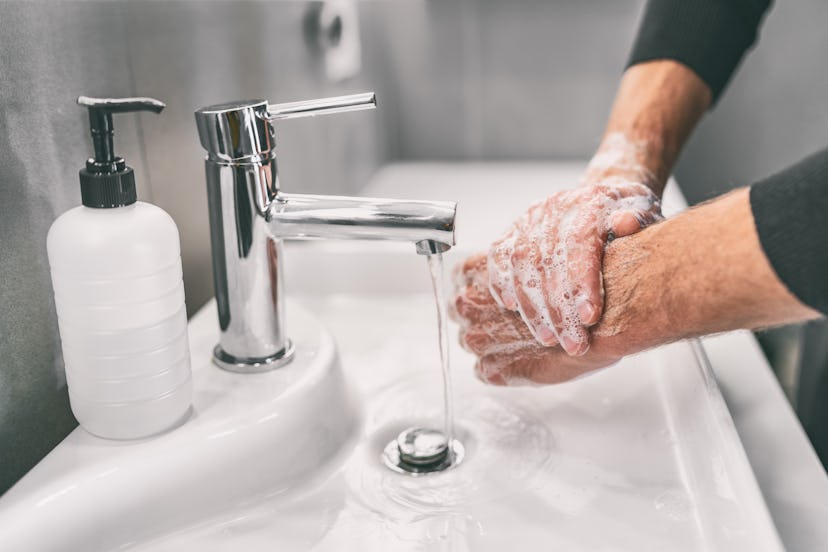 Washing hands rubbing with soap man for corona virus prevention, hygiene to stop spreading coronavir...