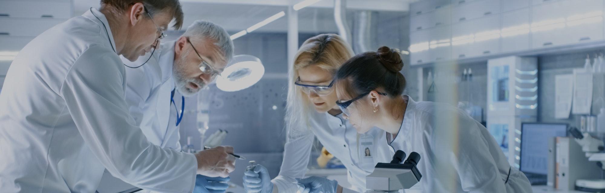 Team of Medical Research Scientists Work on a New Generation Disease Cure. They use Microscope, Test...