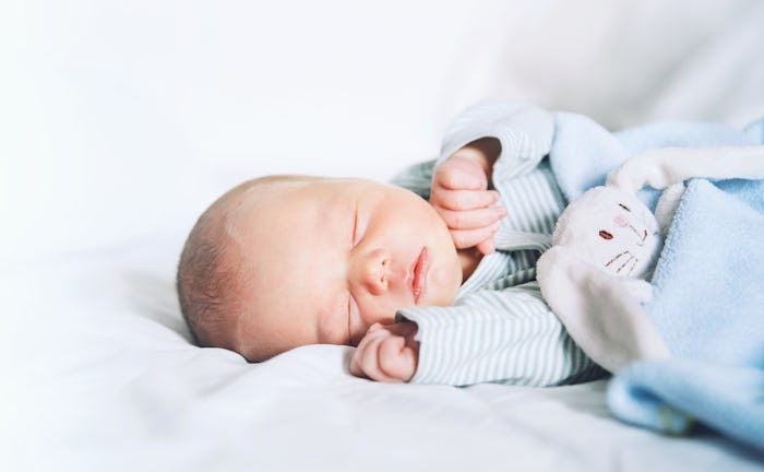 Newborn baby sleep first days of life. Cute little newborn child sleeping peacefully