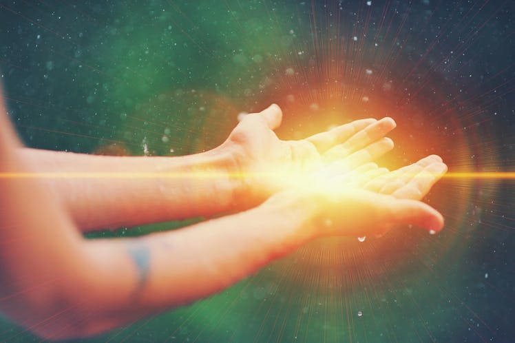 Woman hands praying for blessing from god, blurred nature background, rain, day. Religious human ope...