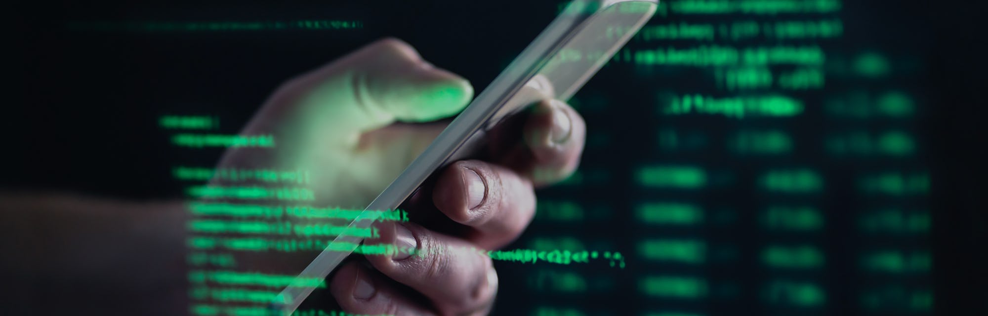 Darkweb, darknet and hacking concept. Hacker with cellphone. Man using dark web with smartphone. Mob...
