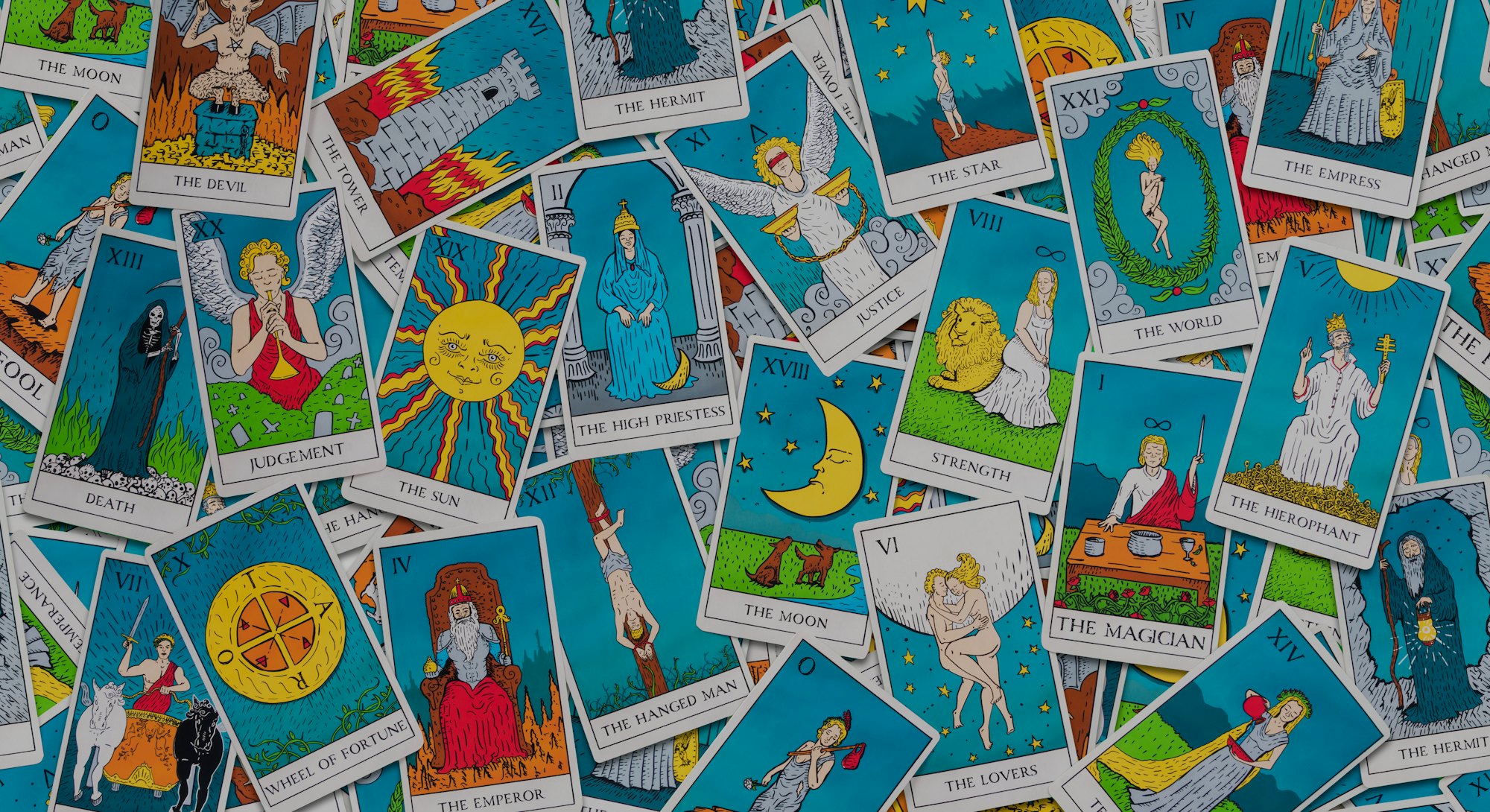 Assorted tarot cards scattered on a table, seamless pattern