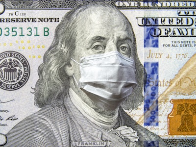 COVID-19 coronavirus in USA, 100 dollar money bill with face mask. Coronavirus affects global stock ...