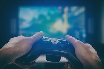 gaming game play tv fun gamer gamepad guy controller video console playing player holding hobby play...