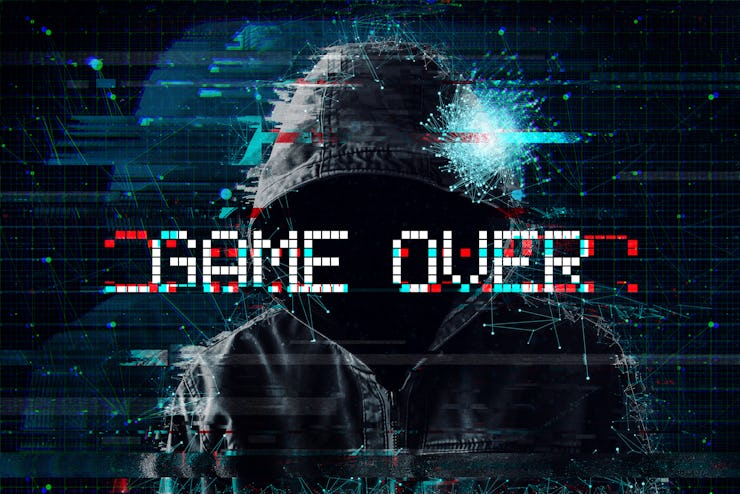 Game over concept with hooded video gamer and glitch effect