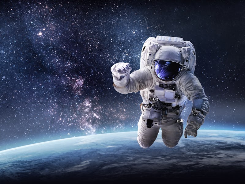 Astronaut in outer space over the planet Earth. Our home. ISS. Elements of this image furnished by N...