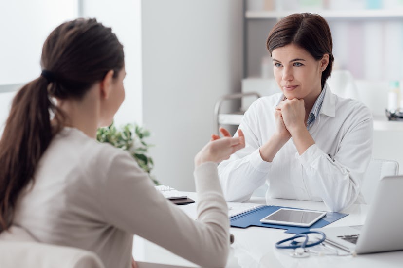 Doctor working in the office and listening to the patient, she is explaining her symptoms, healtcare...