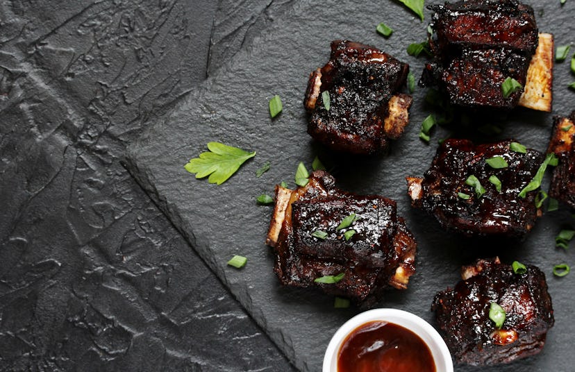 STICKY BEEF SHORT RIBS. Sweet BBQ . Flatlay.  copy space. top view
