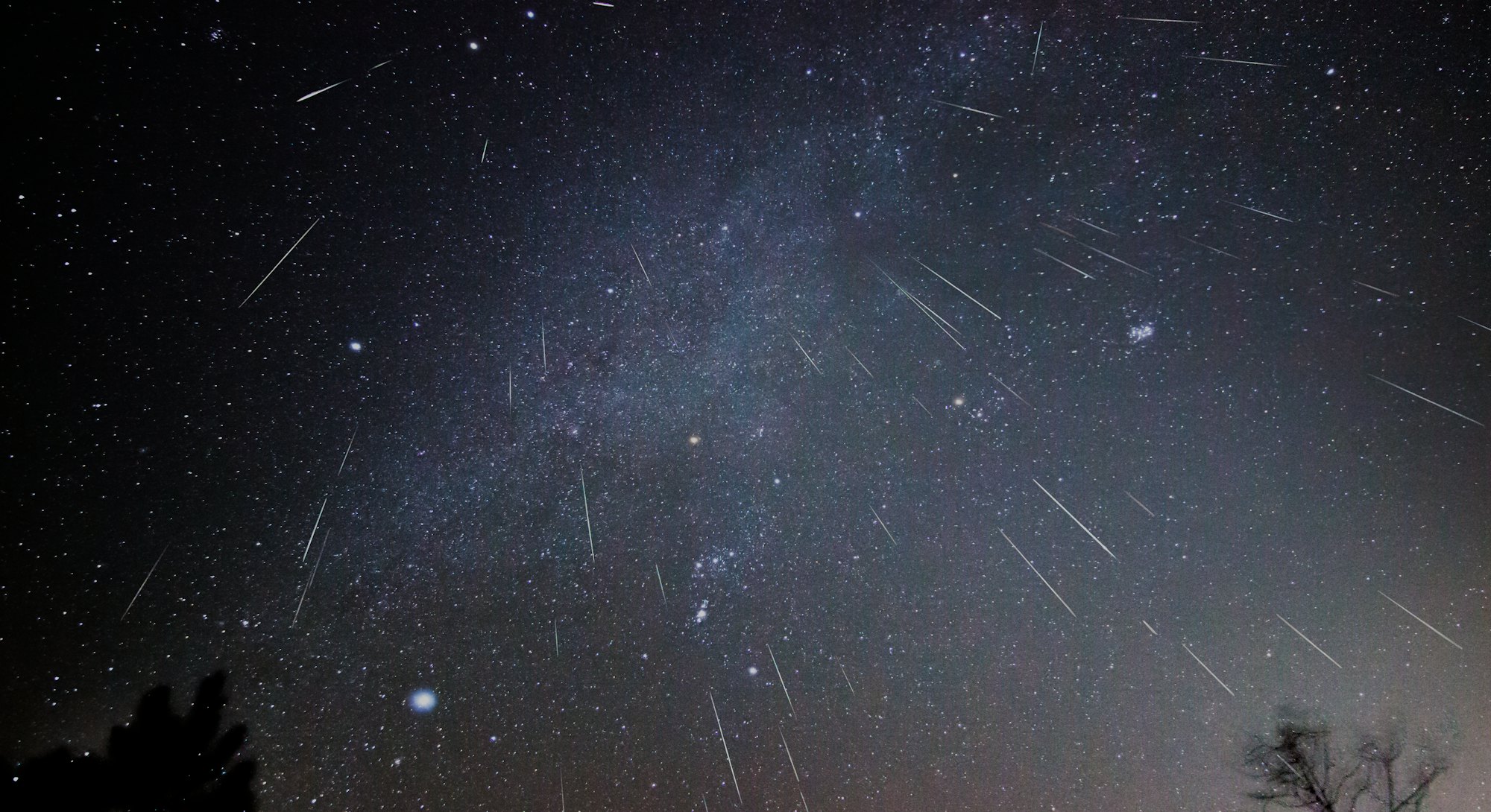 Geminid meteors shower downward in this composite image taken over several hours on a December night...