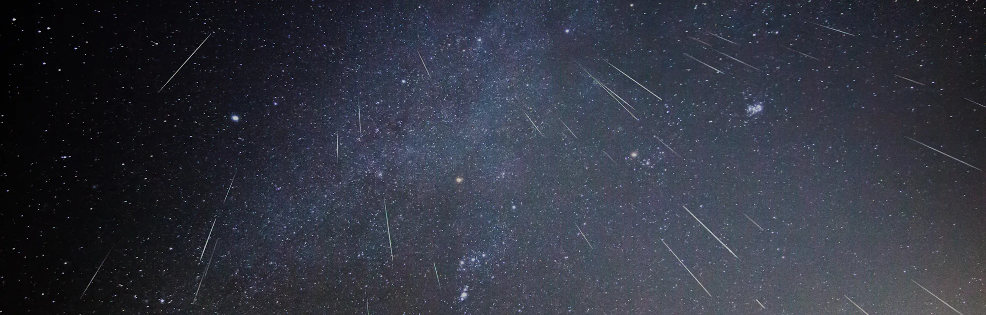 Geminid meteors shower downward in this composite image taken over several hours on a December night...