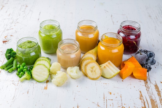 Colorful baby food purees in glass jars