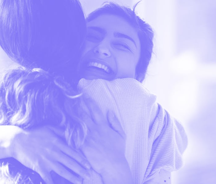 Head shot close up happy mixed race girl cuddling smiling indian female friend. Overjoyed excited be...