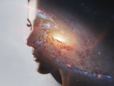 The universe inside us, the profile of a young woman and space, the effect of double exposure. scien...