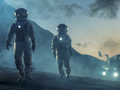 Two Astronauts in Space Suits Confidently Walking on Alien Planet, Exploration of the the Planet's S...