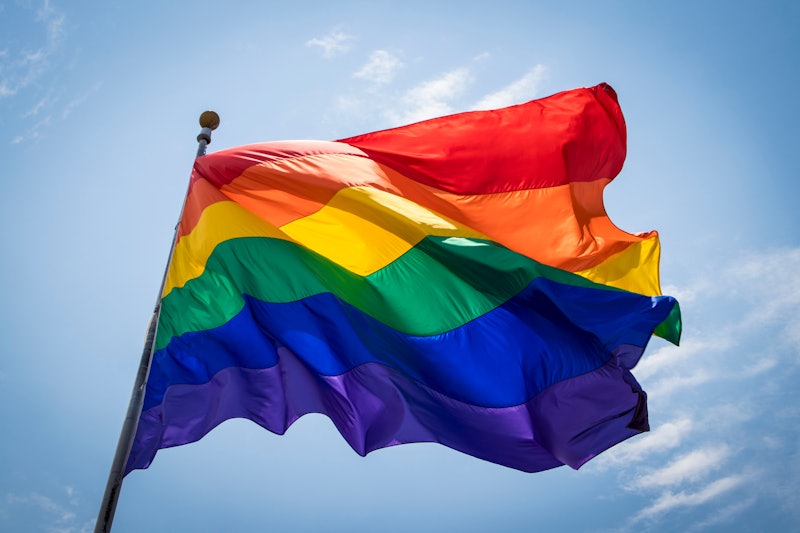 The Rainbow Pride Flag Blows in the Breeze against the Blue Sky over the San Diego LGBT Pride Parade...