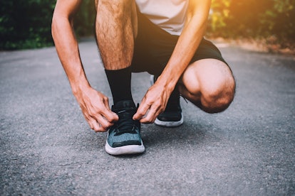 Runners tied in shoes,Man run on the street be running for exercise,Run sports background and closeu...