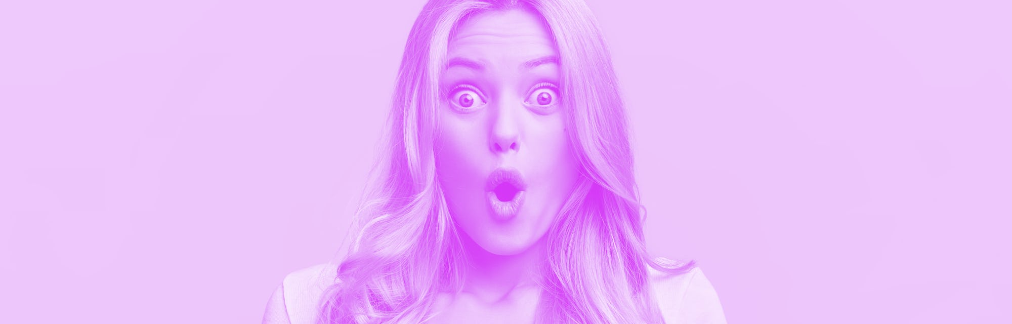 Blonde young female with pleasant appearance looks with terrified expression in smart phone, reads s...